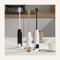 Handheld milk frothers