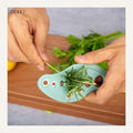 Herb stripper in use
